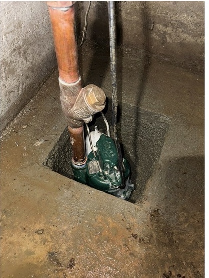 Pump and connected piping installed inside a recessed pit